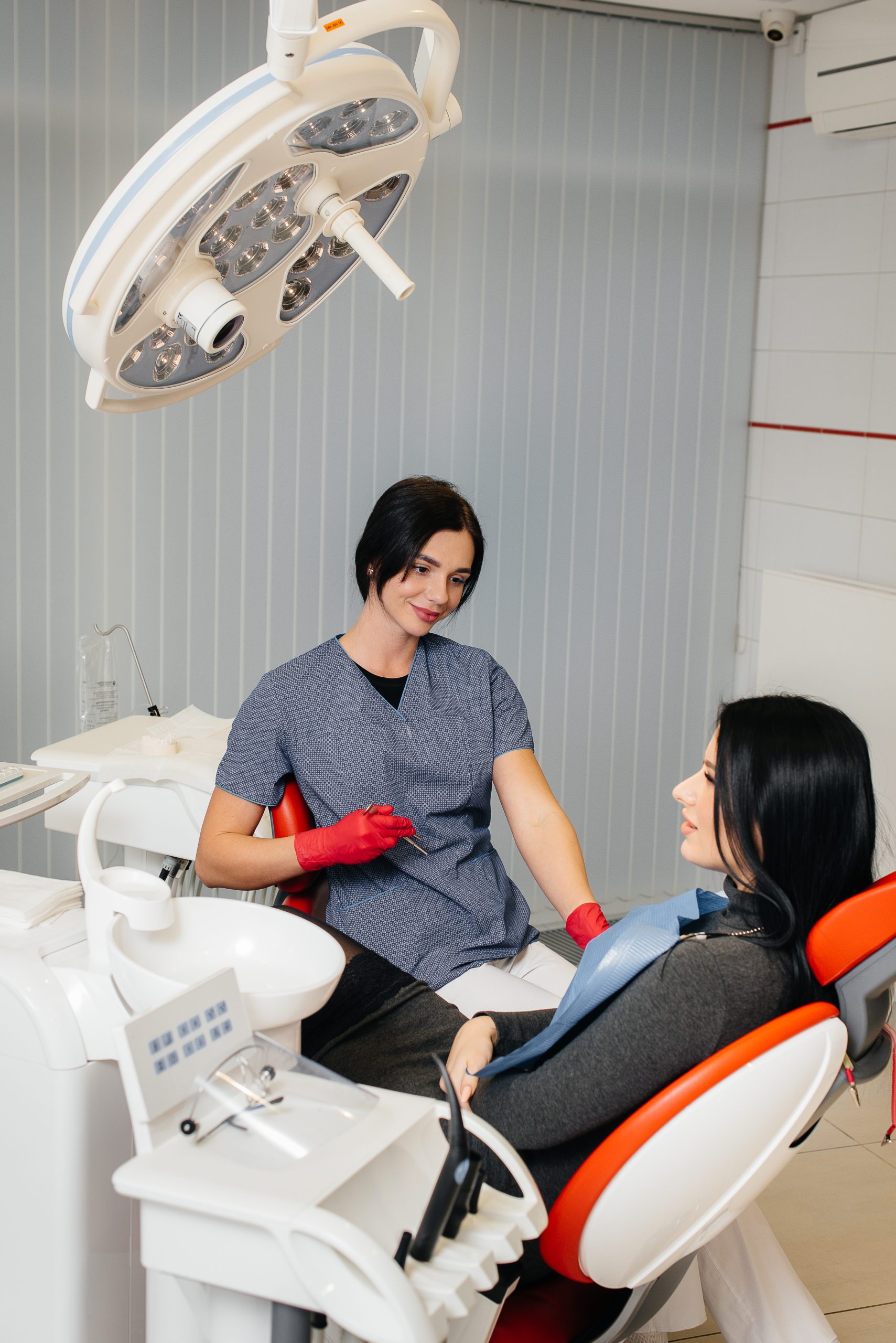 the dentist conducts an examination and consultation of the patient. dentistry.